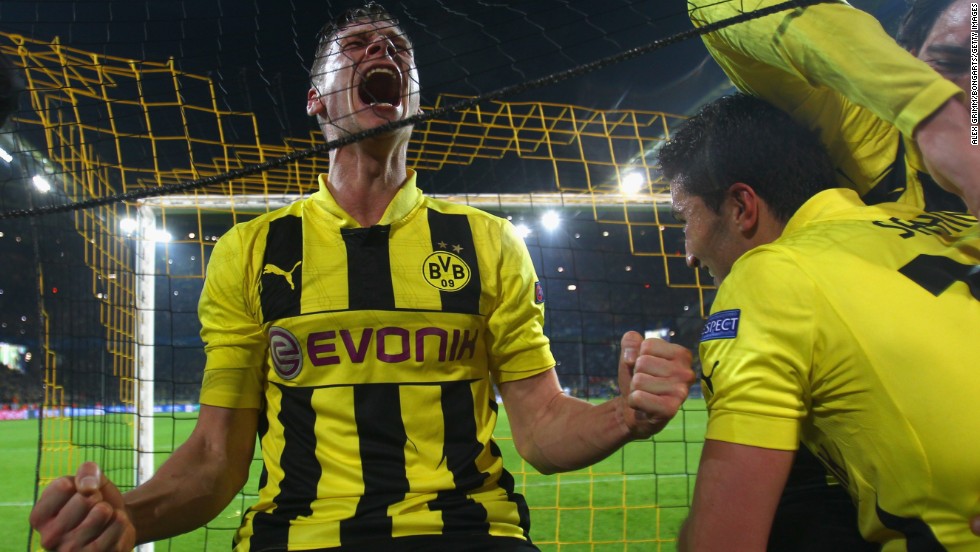 Lukasz Piszczek, Nuri Sahin and Mats Hummels can&#39;t help but go crazy with excitement following the final whistle.