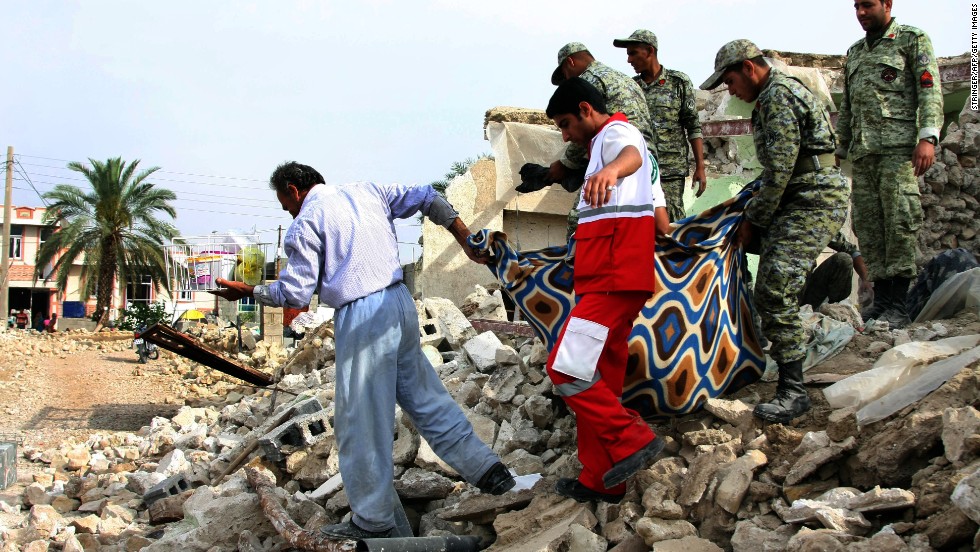 Iranian soldiers and aid workers help a man carry his belongings from his house in Shanbeh on Wednesday, April 10, after a powerful earthquake destroyed it. The magnitude-6.3 quake struck southern Iran on Tuesday, April 9, killing at least 37 people, Iranian state-run media reported. The temblor was centered more than 60 miles southeast of the Bushehr nuclear plant, but Iran&#39;s Press TV said the single-reactor facility was undamaged.