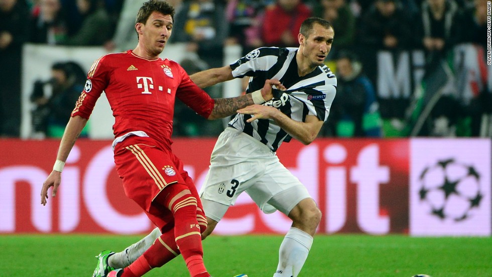 Bayern Munich&#39;s Mario Mandzukic and Juventus&#39; Giorgio Chiellini challenge for the ball during the second leg of the Champions League quarterfinal tie. Bayern won the opening contest 2-0 last week and arrived in Italy just days after winning the German title.