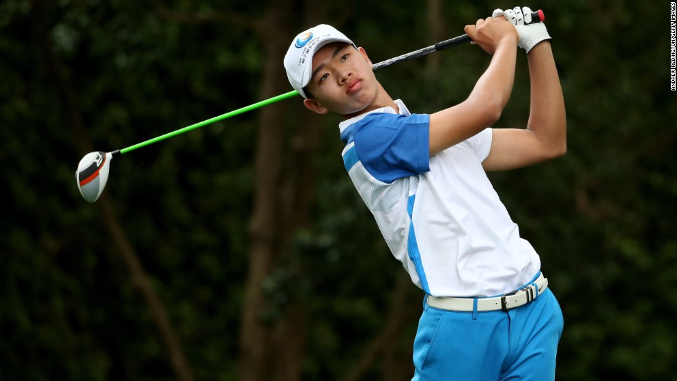 Tianlang Guan of China tees off on the second hole during the first round of the 2013 Masters Tournament at Augusta National Golf Club on Thursday, April 11 in Augusta, Georgia. Guan is the youngest competitor -- at the age of 14 years and five months -- in the 80 years of the tournament, beating the previous record held by then 16-year-old Matteo Manassero.