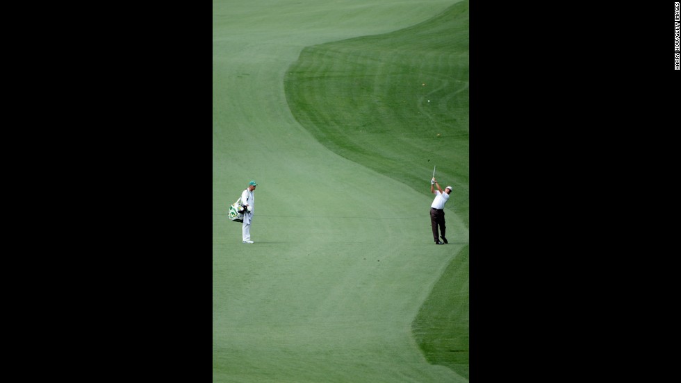 Phil Mickelson of the U.S. hits his second shot on the 10th hole.