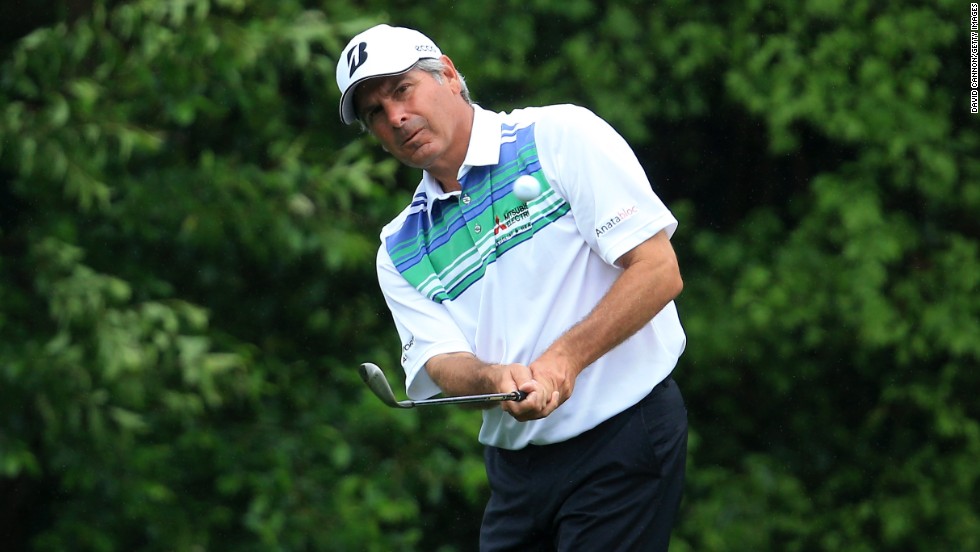 Fred Couples of the United States hits a shot on the fifth hole.
