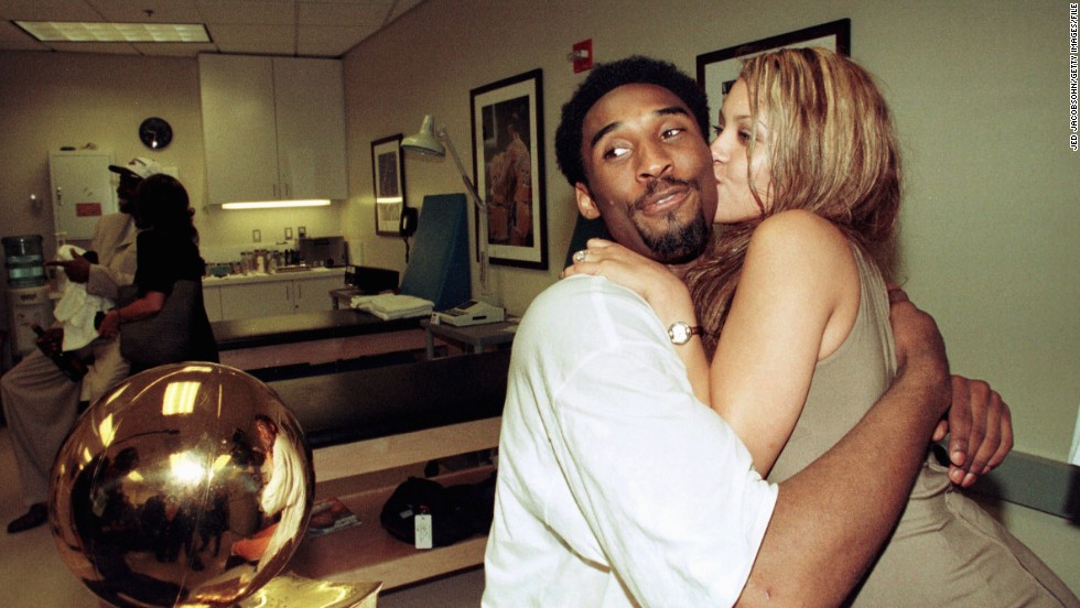 Bryant hugs his fiancee, Vanessa Laine, in the locker room in Los Angeles after the Lakers defeated the Indiana Pacers in Game 6 of the 2000 NBA Finals to win the series 4-2. Bryant later married Laine, and they had four children.