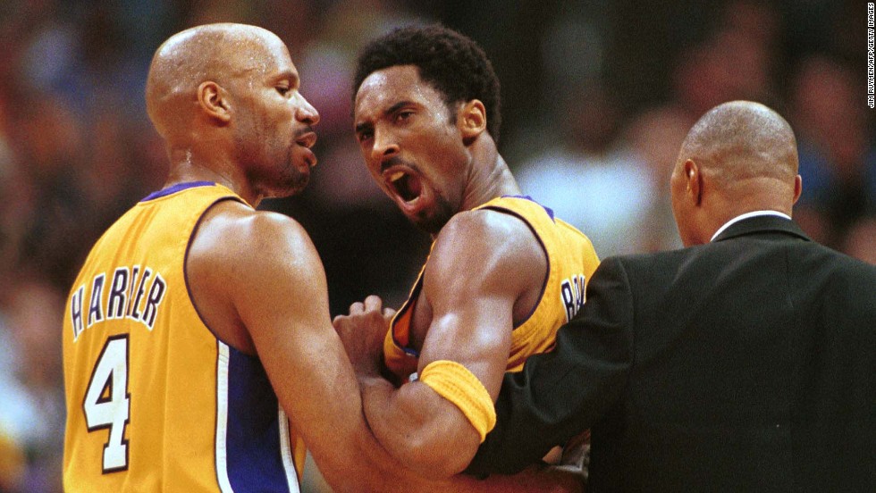 Bryant, center, is restrained by teammate Ron Harper, left, and assistant coach Jim Cleamons after a confrontation with New York Knicks guard Chris Childs on April 2, 2000, at Staples Center. Both players were ejected and the Lakers went on to defeat the Knicks 106-82.