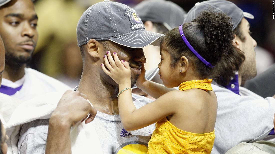 Bryant holds his daughter, Gianna, after the Lakers defeated the Orlando Magic in the 2009 NBA Finals.