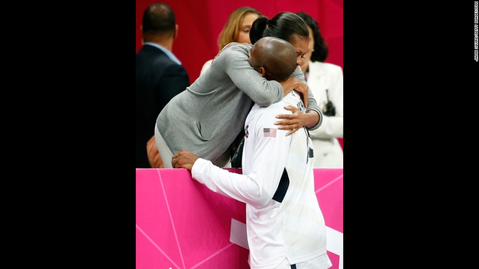 U.S. first lady Michelle Obama hugs Bryant after the  United States played France at the Olympics on July 29, 2012.