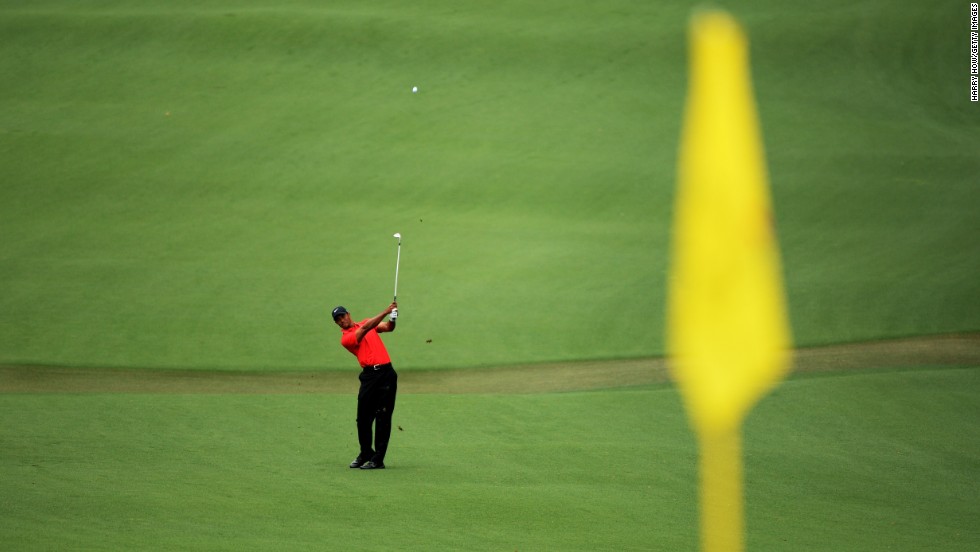 Tiger Woods of the U.S. hits a shot on the second hole.
