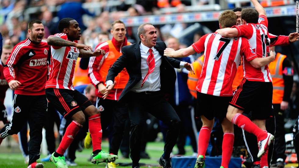 Di Canio celebrates with his Sunderland players during their crucial victory.  Sunderland is now three points clear of the relegation zone with five games remaining.