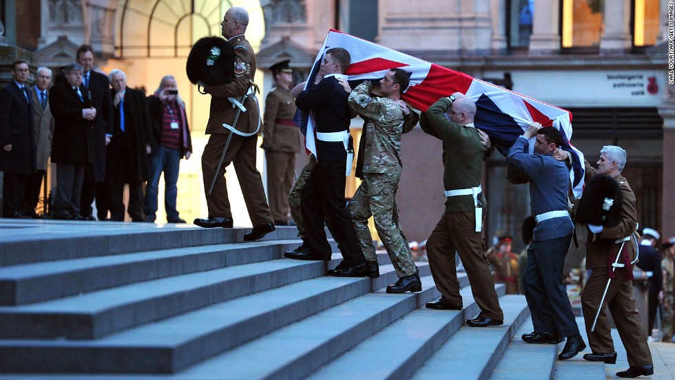 Bearer Party from the three military services carry a coffin up the steps of St Paul&#39;s Cathedral during the rehearsal for the ceremonial funeral.