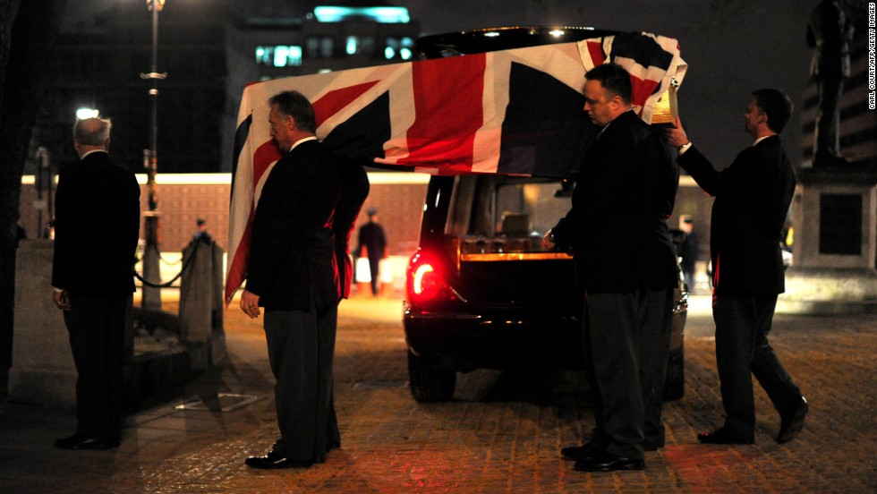 Pallbearers carry a coffin into St Clement Danes church during the rehearsal.