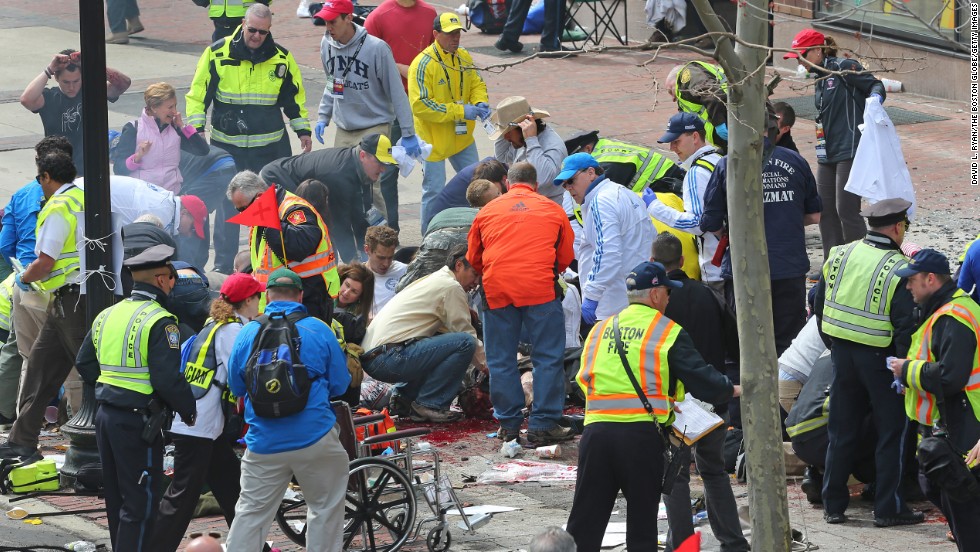 Police and emergency crews tend to victims.