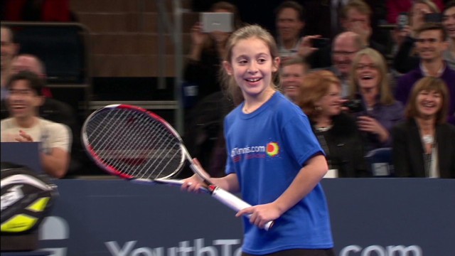 Little girl takes on tennis giants