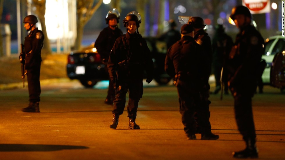 Boston police gather in front of a Best Buy on Friday.