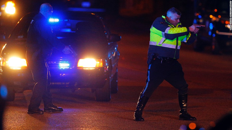 Police officers keep a man on the ground in Watertown on Friday. &lt;a href=&quot;http://www.cnn.com/2013/04/19/us/gallery/boston-ghost-town/index.html&quot;&gt;See all photography related to the Boston bombings.&lt;/a&gt;