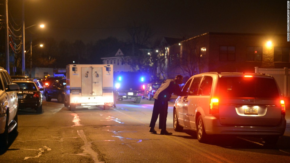  Police stop cars at School and Walnut streets on Friday.