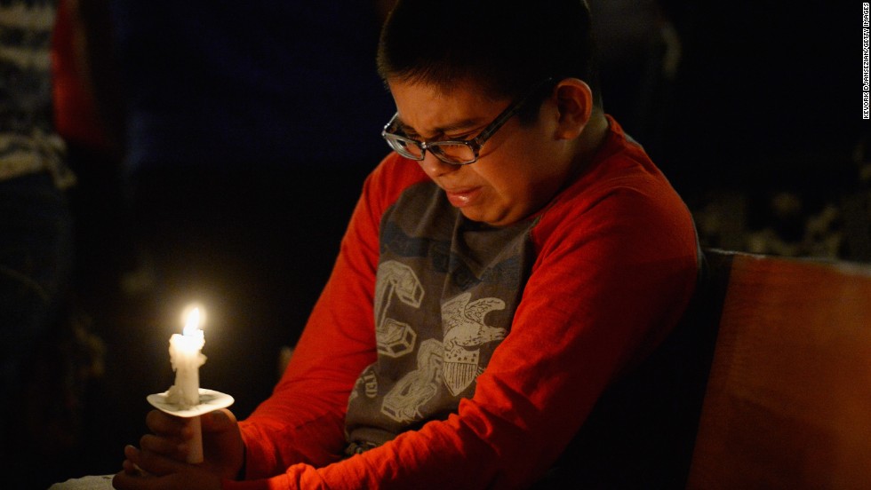 Eric Garcia, 12, cries during a candlelight vigil in West, Texas, honoring the victims of the explosion on April 18. More than 200 people were injured and 50 homes destroyed in the small town.