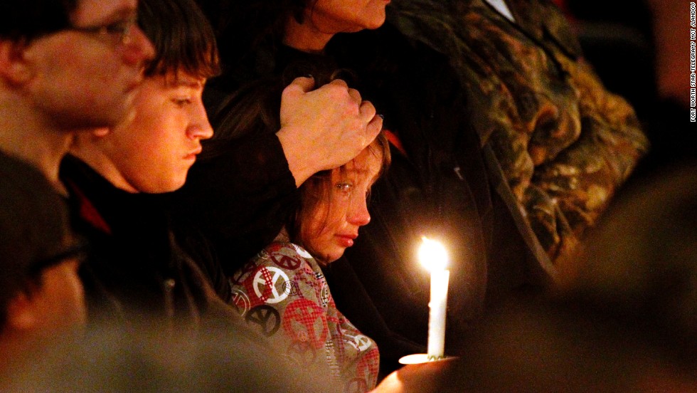 A young mourner is comforted during the vigil on April 18.