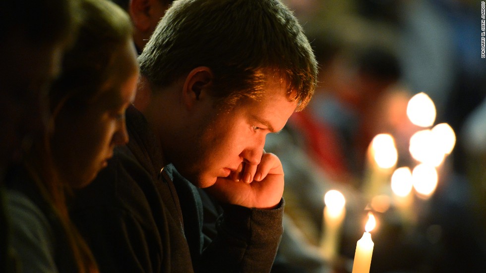 A young man holds a candle during the vigil.&lt;a href=&quot;http://www.cnn.com/2013/04/18/us/gallery/texas-explosion/index.html&quot;&gt; &lt;/a&gt;