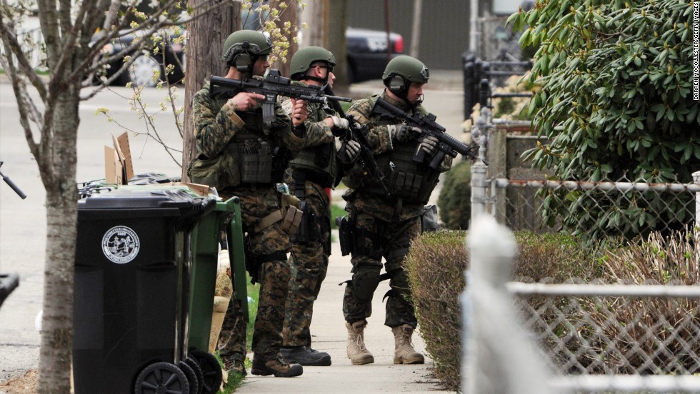 Police to continue to the door-to-door search on Francis Street in Watertown, Massachusetts, on Friday.