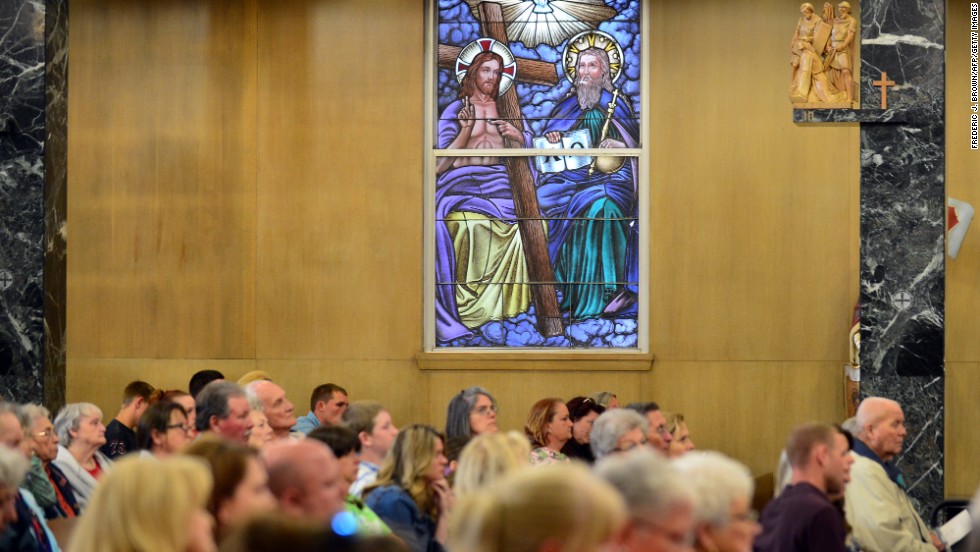 Residents tend a prayer service at St. Mary&#39;s.