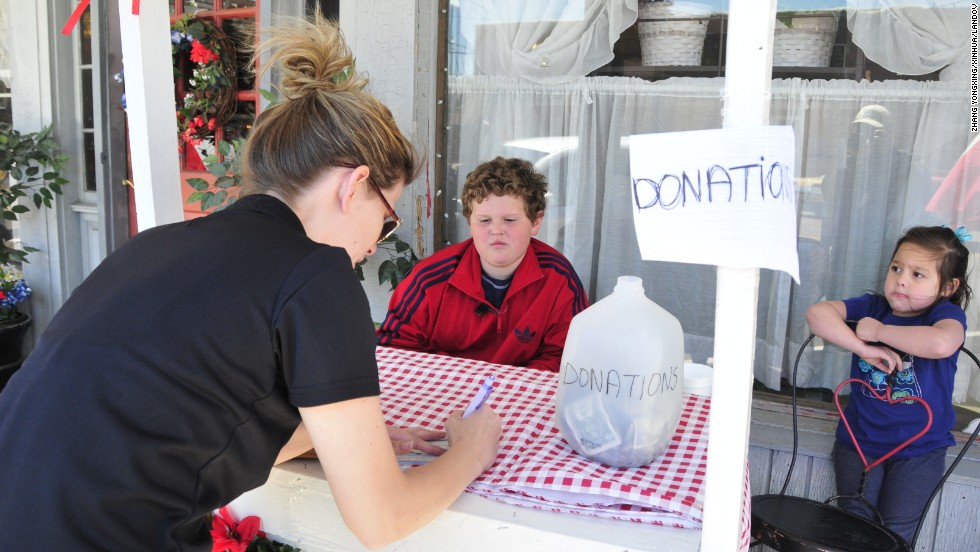 Residents collect donations on Saturday, April 20.