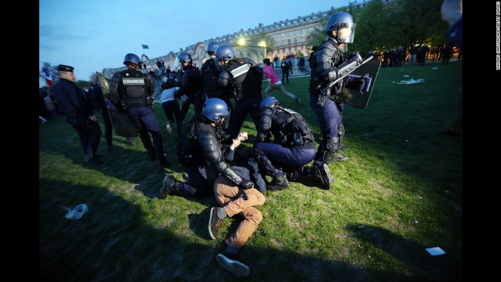 Police officers hold down a demonstrator at the &quot;La Manif Pour Tous&quot; demonstration on Sunday.