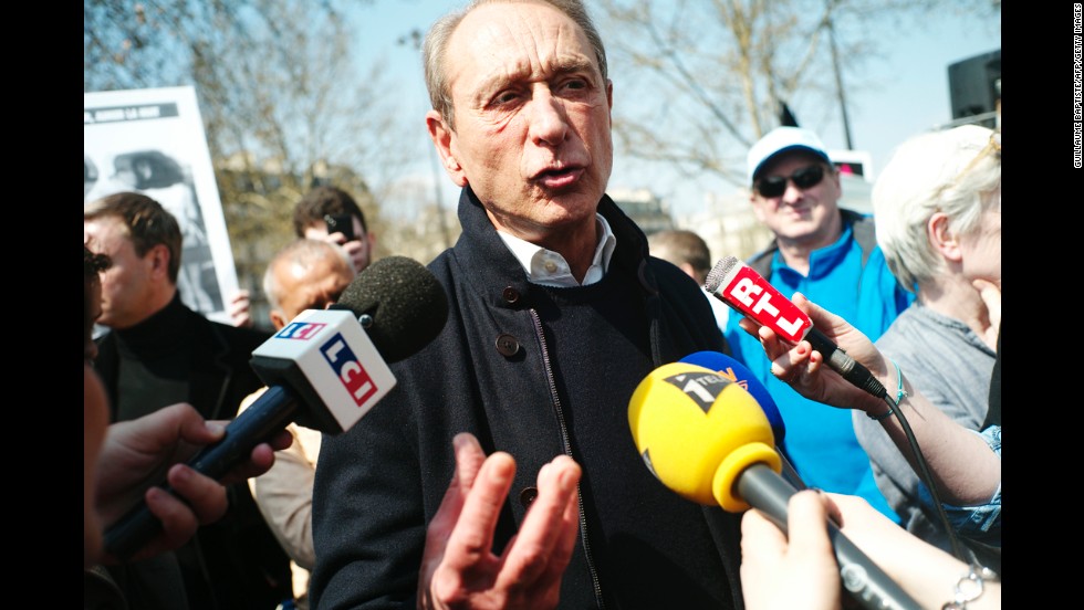 Paris Mayor Bertrand Delanoe speaks to journalists at Bastille Square during a pro-gay rights demonstration on Sunday.