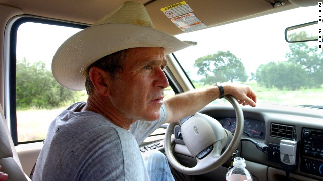 President George W. Bush drives his pickup truck at his ranch in Crawford, Texas, Friday, Aug. 9, 2002. WHITE HOUSE PHOTO BY ERIC DRAPER