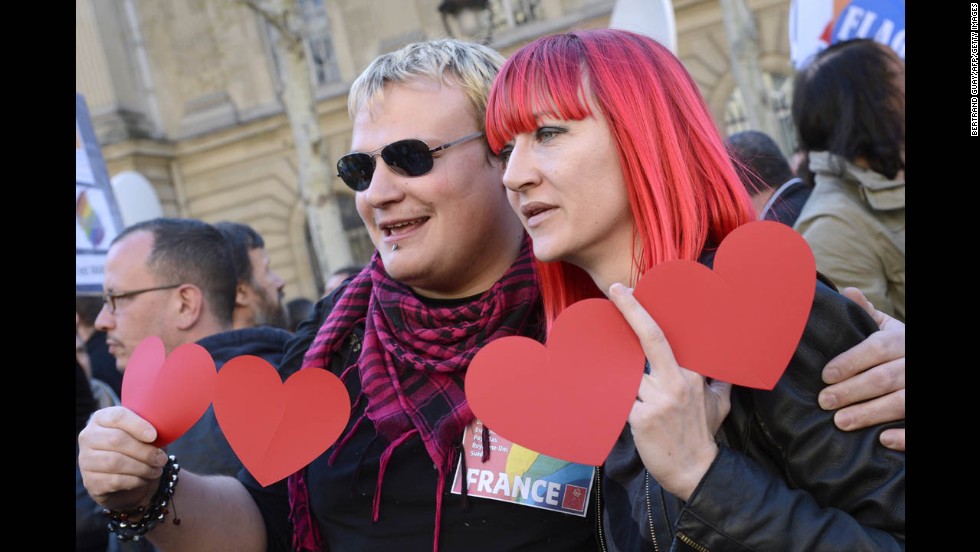 Supporters of same-sex marriage pose for photos during Tuesday&#39;s celebrations in Paris.