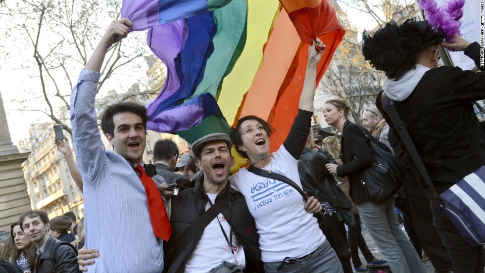 People celebrate at Paris City Hall on Tuesday, April 23, after the &lt;a href=&quot;http://www.cnn.com/2013/04/23/world/europe/france-same-sex-vote/index.html&quot;&gt;French National Assembly adopted a bill legalizing same-sex marriage&lt;/a&gt; and adoptions for gay couples. 