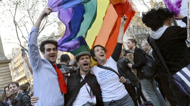 People celebrate in Paris on April 23, 2013, after the French National Assembly adopted a bill legalizing same-sex marriages.