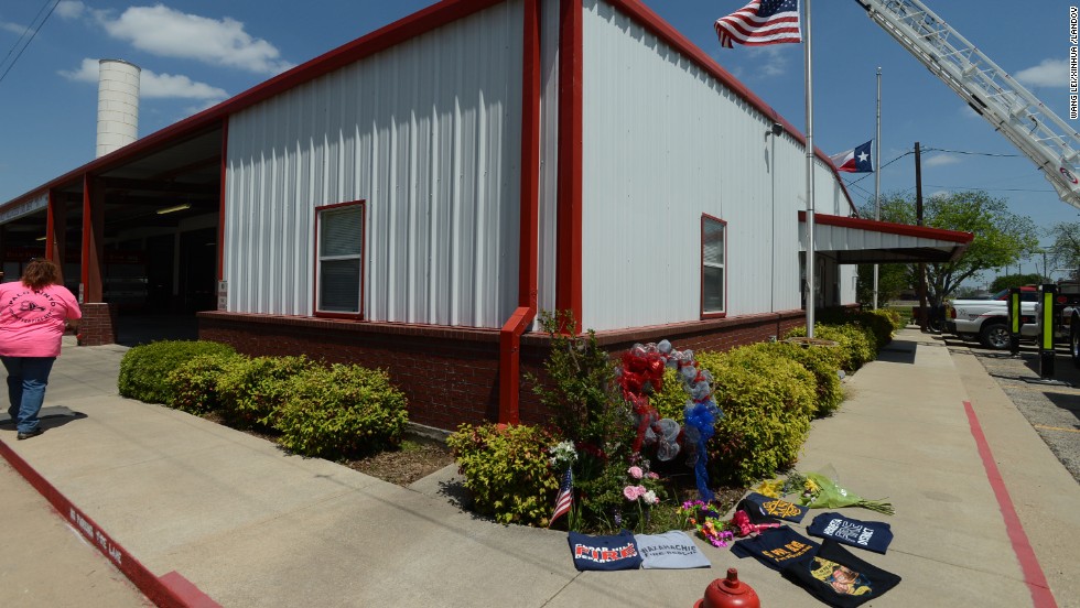 A memorial is set up on Monday, April 22, outside a fire station for the firemen who perished in the explosion.