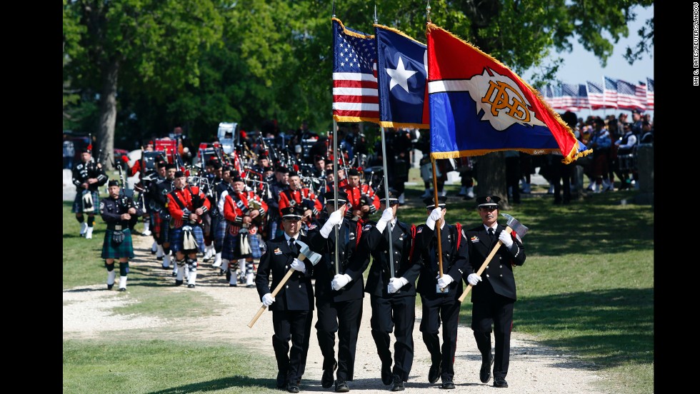 Firefighters lead the funeral procession for Capt. Kenneth &quot;Luckey&quot; Harris Jr. on Thursday, April 24, in West, Texas. 