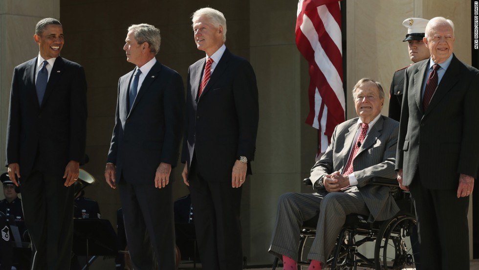 President Barack Obama and former presidents George W. Bush, Bill Clinton, George H.W. Bush and Jimmy Carter arrive on stage for the George W. Bush Presidential Center dedication ceremony.