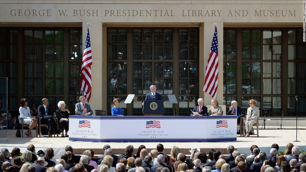 Former president George W. Bush, center, speaks to the crowd at the opening ceremony of the George W. Bush Presidential Center, flanked, left to right, by first lady Michelle Obama, President Barack Obama, former first lady Barbara Bush, former President George H.W. Bush, former first lady Laura Bush, former President Bill Clinton, former first lady Hillary Clinton, former President Jimmy Carter and former first lady Rosalynn Carter.
