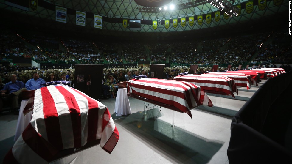 Coffins containing the remains of victims from the fertilizer plant explosion in the town of West, Texas, at a memorial on April 25.