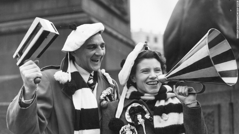 These happy fans are on their way to the English FA Cup final in 1952 but they would not be allowed to support their team using rattles or loudhailers at many global stadiums today.