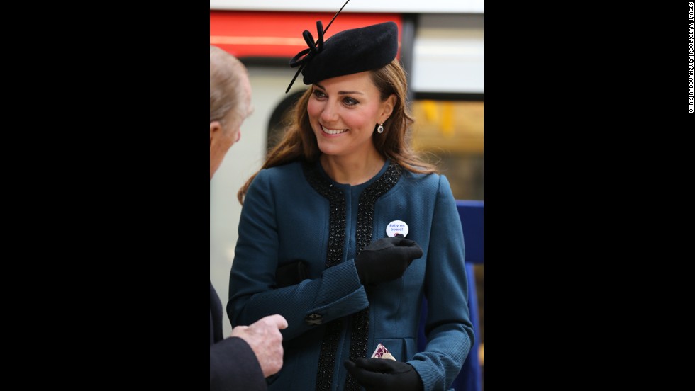 To mark the 150th anniversary of the London Underground on March 20, the Duchess of Cambridge visits the Baker Street Underground Station, wearing a pin that reads, &quot;Baby on Board!&quot;
