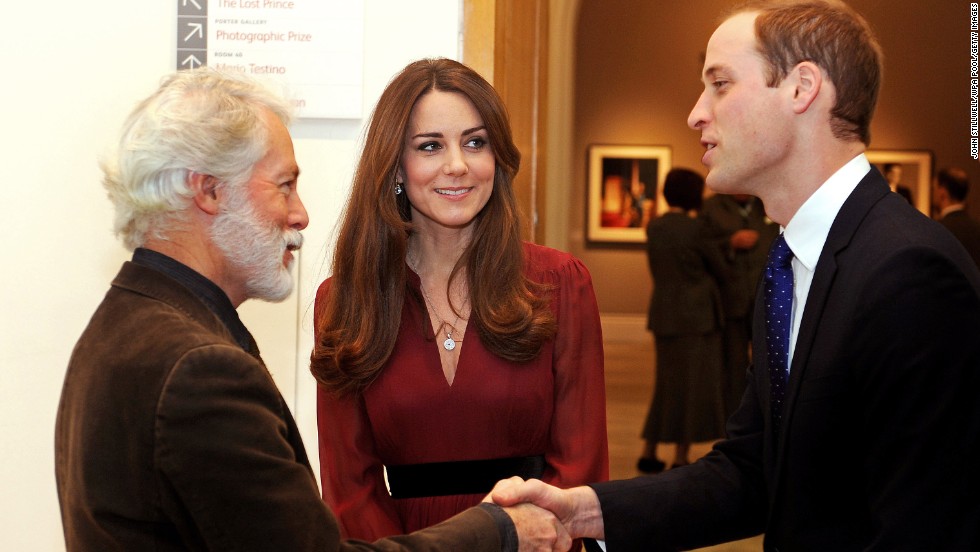 Prince William shakes hands with artist Paul Emsley as Catherine looks on after viewing his &lt;a href=&quot;http://www.cnn.com/2013/01/11/world/europe/duchess-of-cambridge-first-portrait&quot;&gt;new portrait of the Duchess&lt;/a&gt; during a private viewing at the National Portrait Gallery on January 11.
