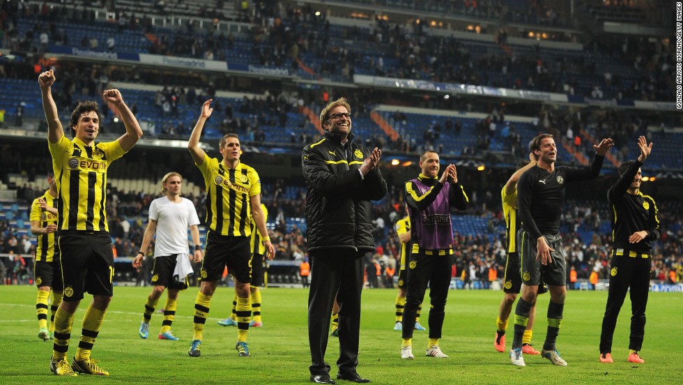 Dortmund manager Jurgen Klopp celebrates with his players following the 2-0 defeat which allowed his side to qualify for the final 4-3 on aggregate. It is the first time since 1997 that Dortmund has reached the final when it defeated Juventus 3-1.