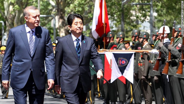 Japanese PM Shinzo Abe, right, and his Turkish counterpart Recep Tayyip Erdogan review an honor guard in Ankara on May 3.