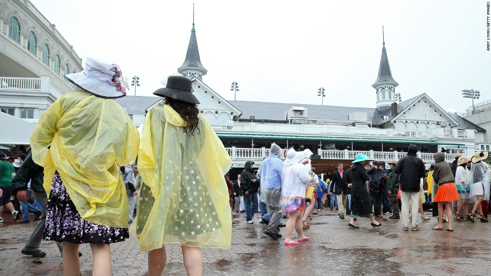 Race fans brave the wet weather as they enjoy the festivities prior to the race.