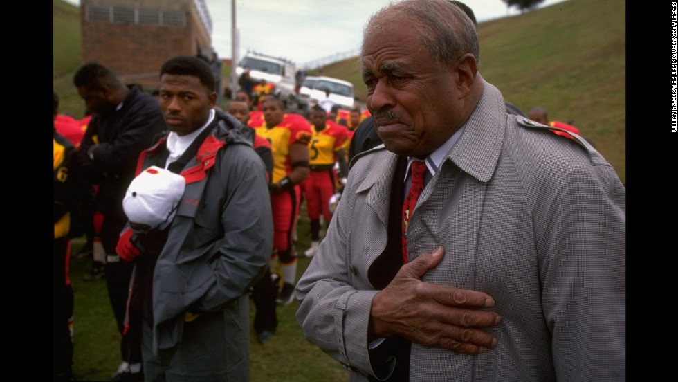 Eddie Robinson served as Grambling State University&#39;s head football coach for 57 seasons from 1941 to 1997. Robinson -- here listening to the national anthem before his final game -- coached more than 4,000 players. 