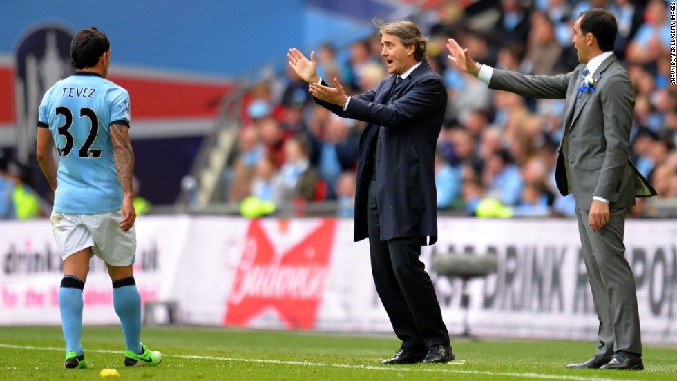 Speculation has been rife that the clubs&#39; respective managers will be elsewhere next season. Reports claim City&#39;s Roberto Mancini, center, will be replaced by Malaga&#39;s Manuel Pellegrini, while Martinez has been linked with a move to Everton.