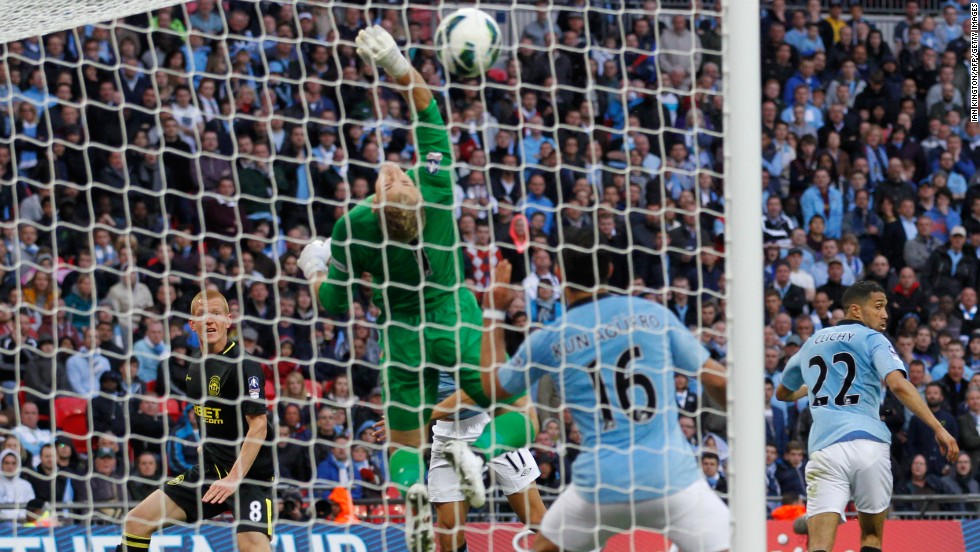 Wigan&#39;s winner came in time added on from substitute midfielder Ben Watson, left, who headed past City&#39;s England goalkeeper Joe Hart. Watson missed almost six months this season with a broken leg. 
