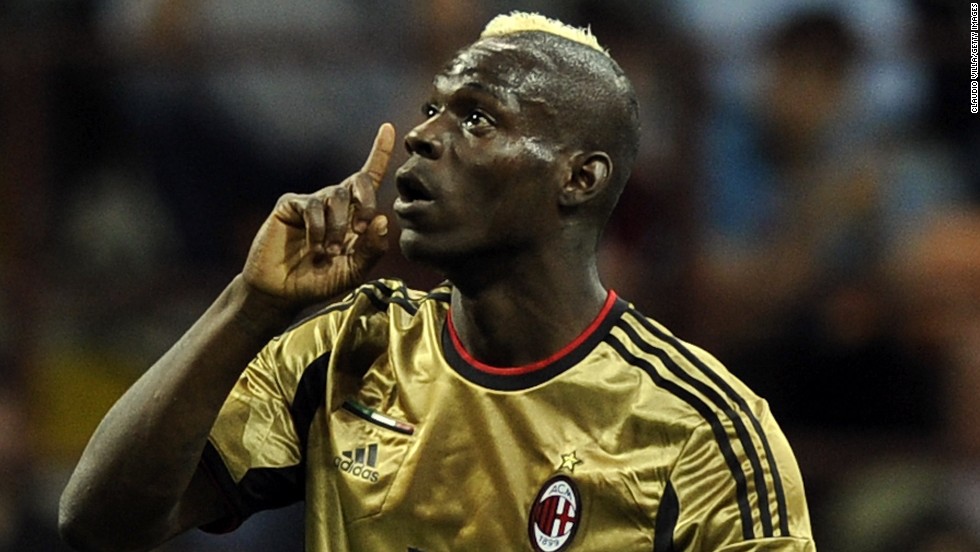 AC Milan&#39;s Mario Balotelli reacts to racist abuse from the visiting Roma fans at the San Siro in May 2013. It was not the first time the Italian-born striker has been racially abused in Serie A. Balotelli has since moved clubs and now plays for Liverpool in the Premier League.