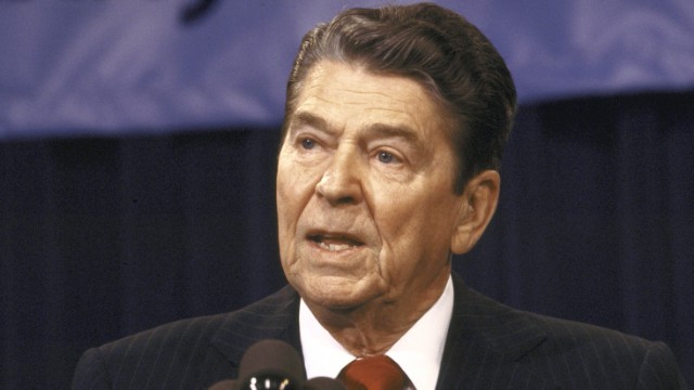 Reagan speaking to the press during Iran-Contra hearings.  