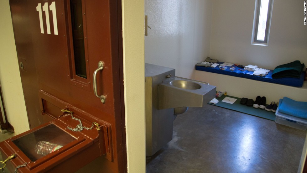 The box protruding from a cell door is known as a &quot;splash box.&quot;  It is used to keep detainees from being able to splash guards with bodily fluids, a practice that has become a daily occurrence since the start of the hunger strike.  