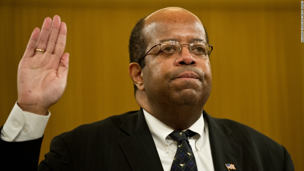 Treasury Inspector General for Tax Administration J. Russell George is sworn in before testifying in Washington in May 2013. According to his report, the IRS developed and followed a faulty policy for determining whether applicants were engaged in political activities, which would disqualify the groups from receiving tax-exempt status.