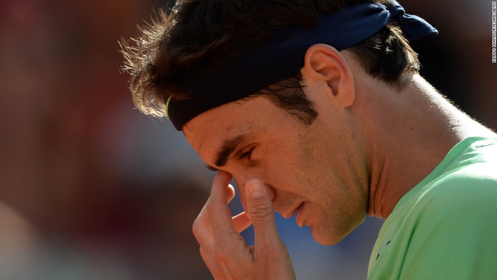 A dejected Roger Federer slips to a straight sets defeat to Nadal in the Rome Masters final.